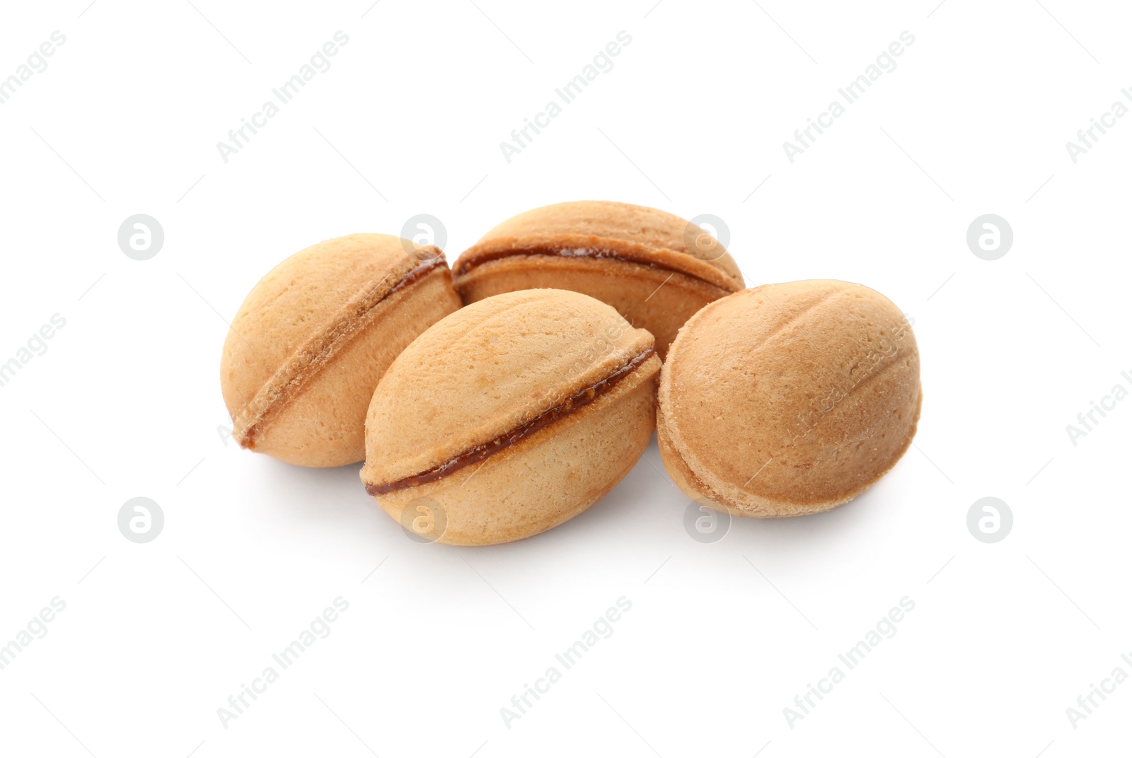 Photo of Delicious nut shaped cookies with boiled condensed milk on white background