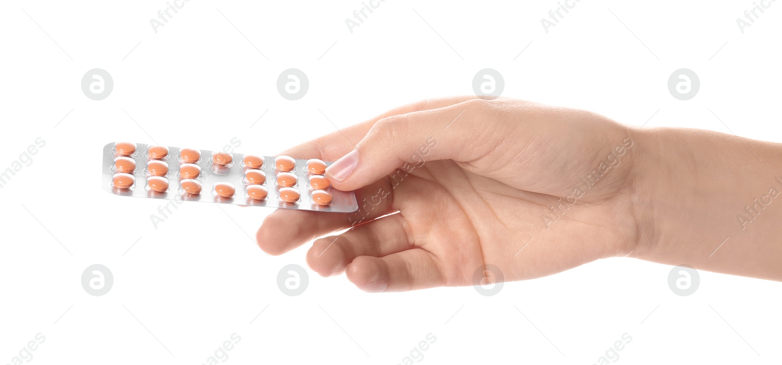 Photo of Woman holding pills in blister pack on white background, closeup