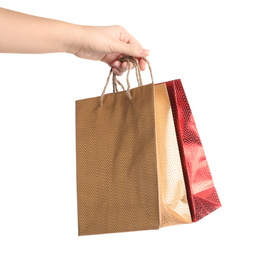 Photo of Woman holding paper shopping bags on white background, closeup. Space for design