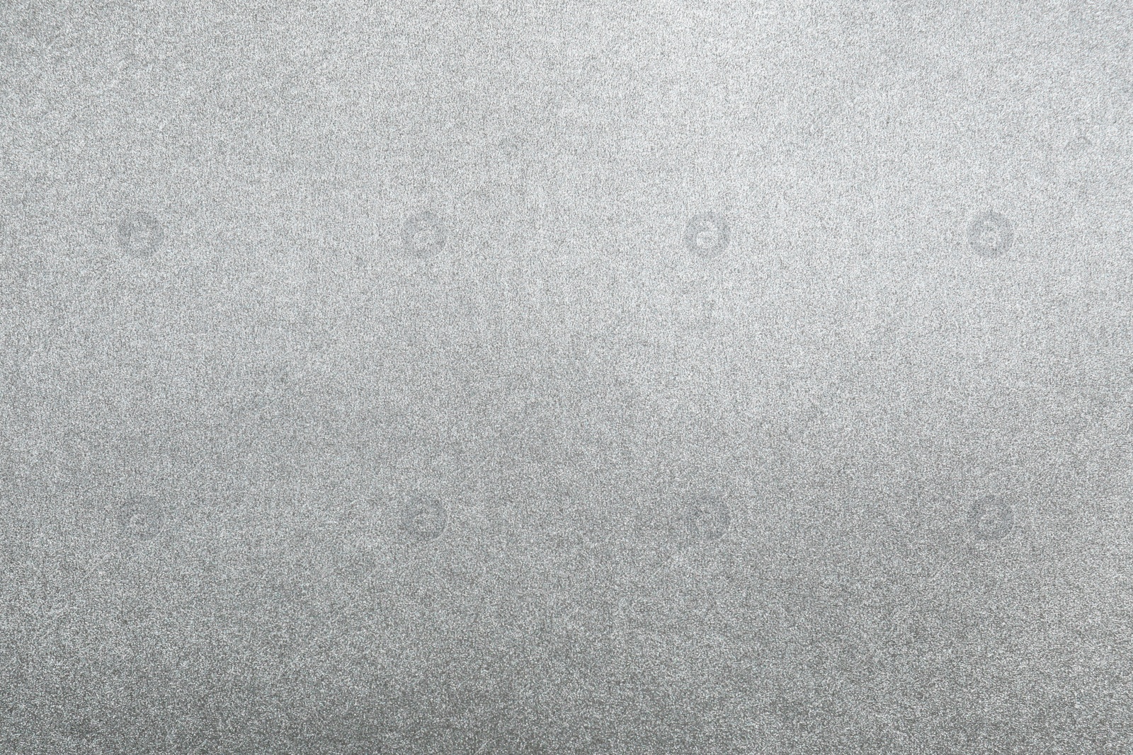 Photo of Closeup view of silver surface as background