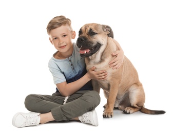 Cute little child with his dog on white background