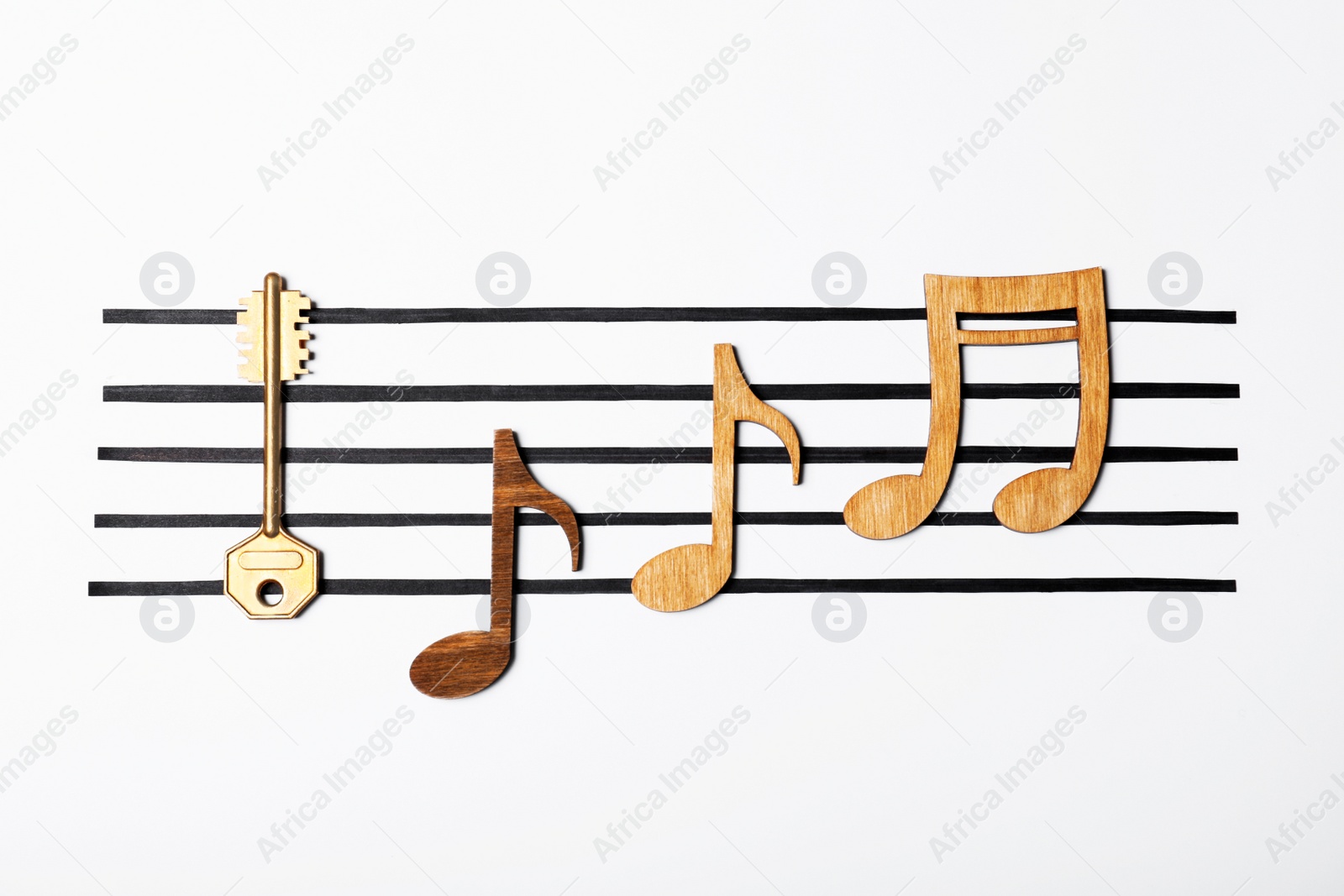 Photo of Creative composition with wooden notes and key on white background. Be different