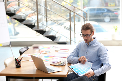 Photo of Professional interior designer at workplace in office