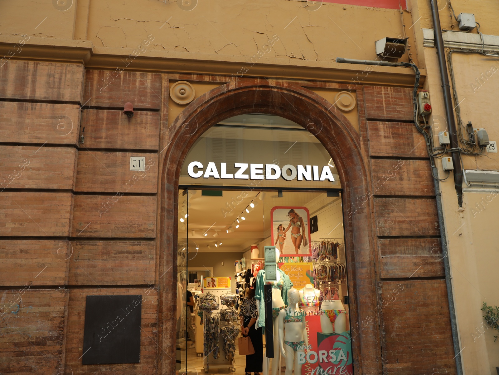 Photo of JESI, ITALY - MAY 17, 2022: Entrance of Calzedonia store on city street