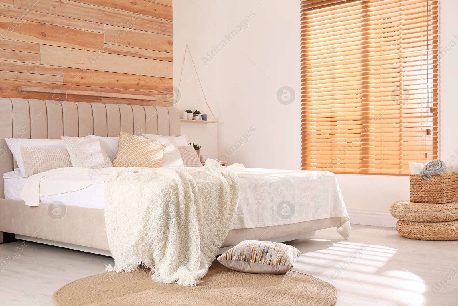 Photo of Stylish room interior with big comfortable bed