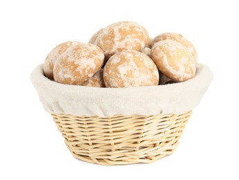 Photo of Tasty homemade gingerbread cookies in wicker basket on white background