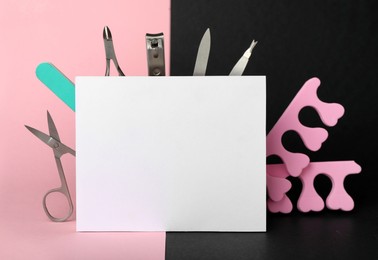 Set of manicure tools and blank card on color background. Space for text