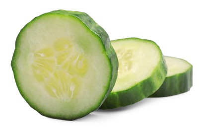 Photo of Slices of long cucumber isolated on white