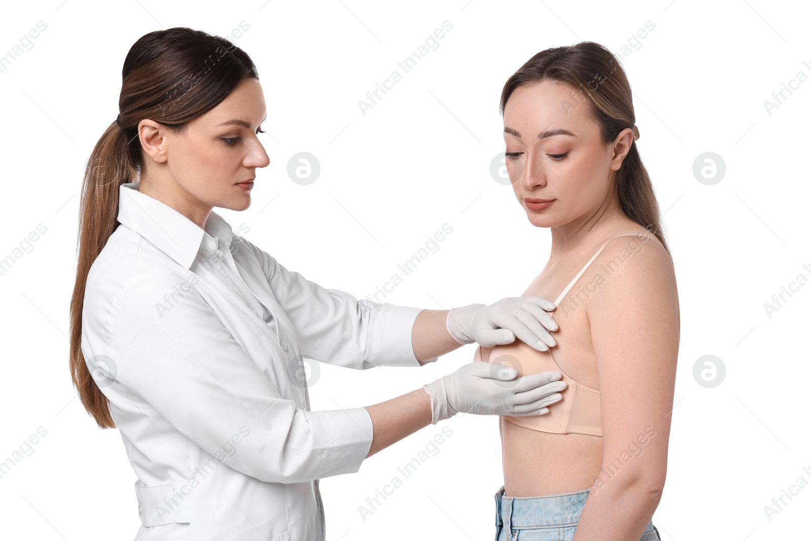 Photo of Mammologist checking woman's breast on white background