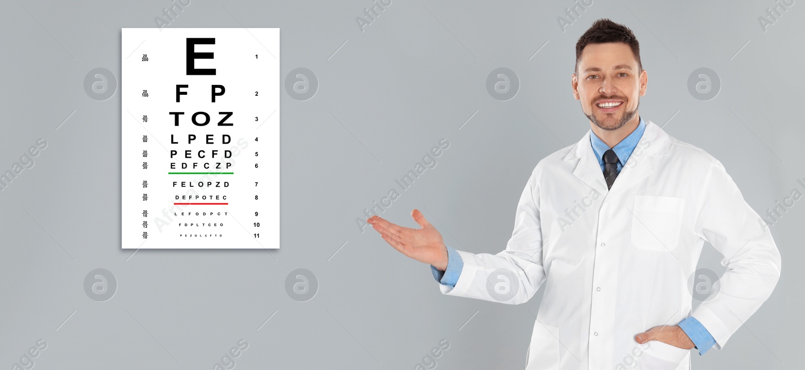 Image of Vision test. Ophthalmologist or optometrist pointing at eye chart on light grey background, banner design