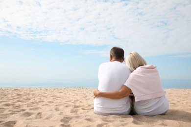 Mature couple spending time together on sea beach