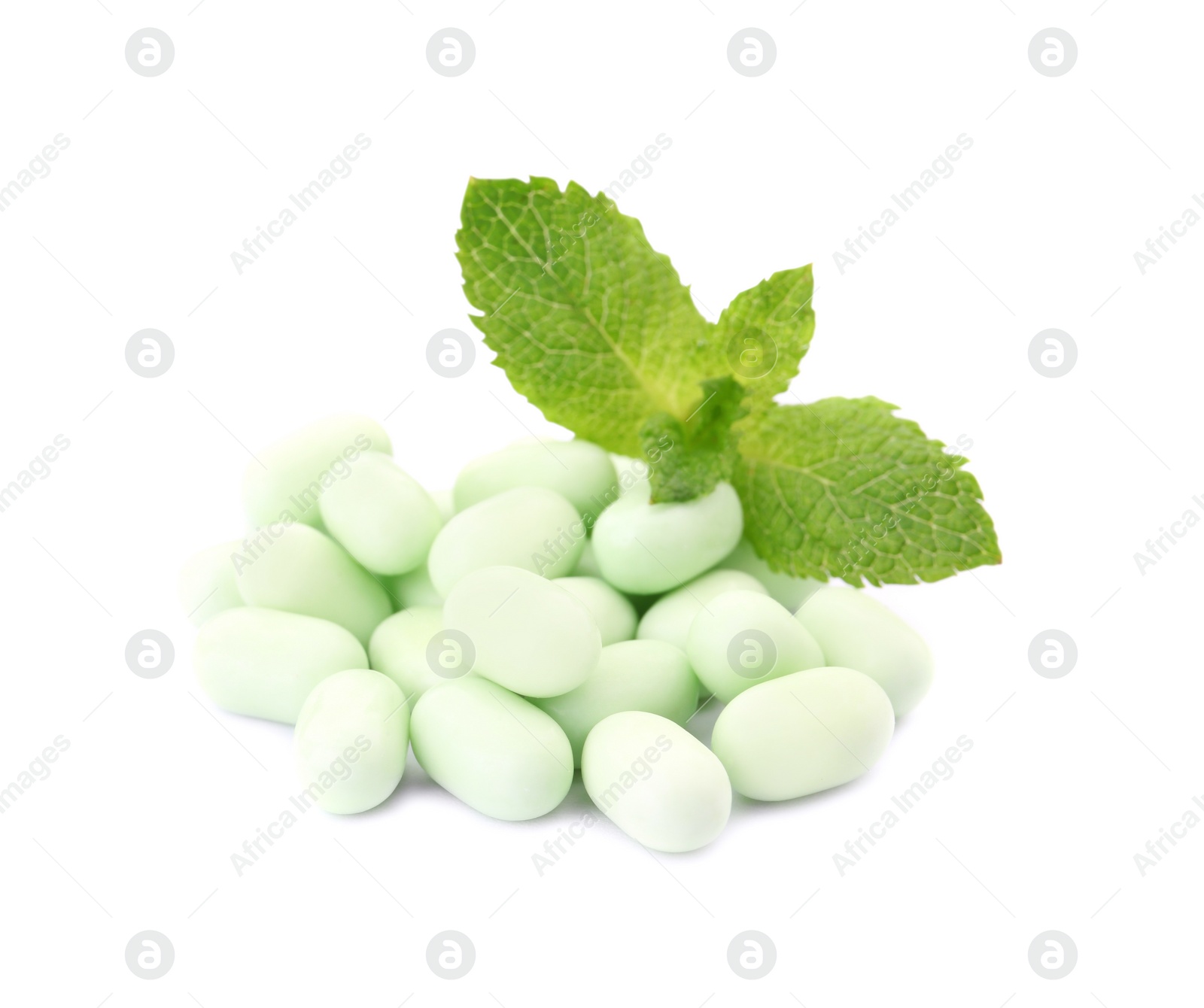 Photo of Tasty mint candies and leaves on white background