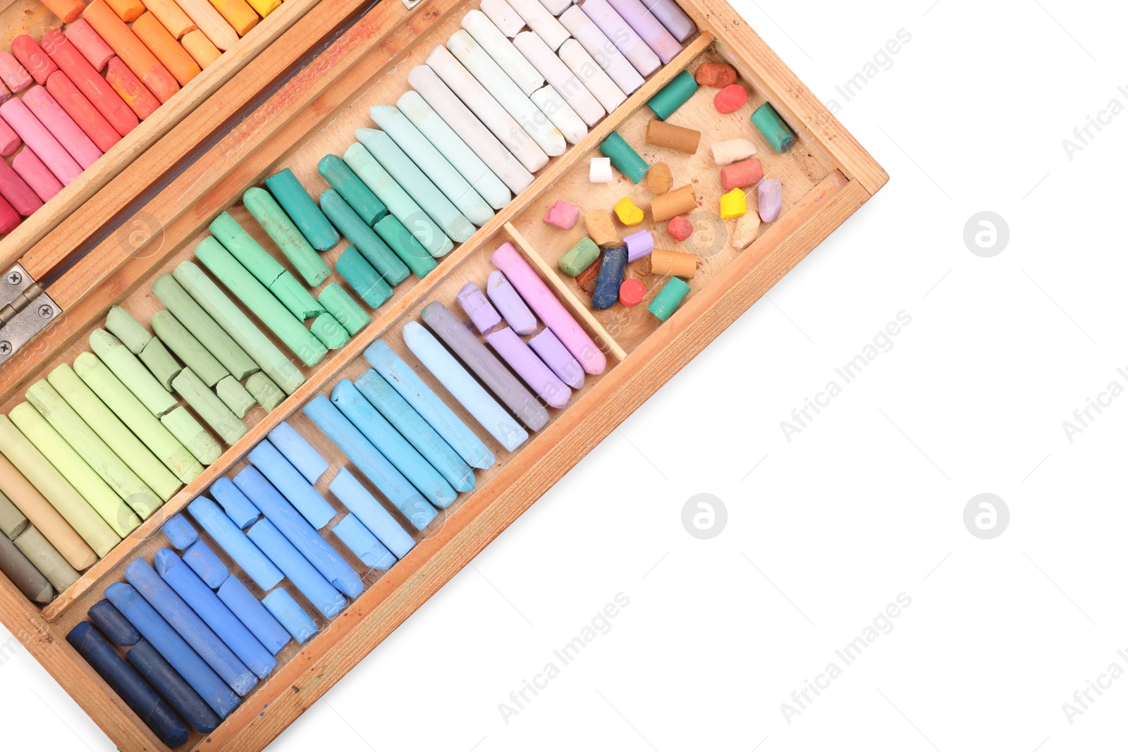 Photo of Set of soft pastels on white background in wooden box, top view. Drawing material