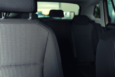 Photo of Car seat with grey upholstery, closeup view