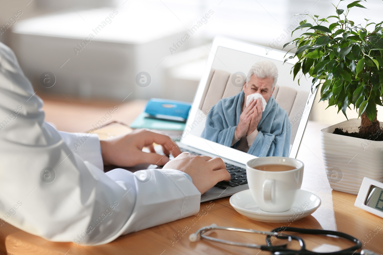 Image of Doctor consulting sick patient online by video chat in medical office, closeup