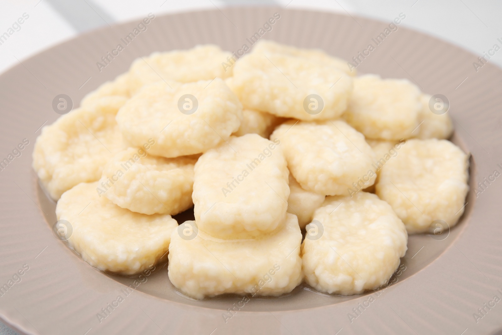 Photo of Tasty lazy dumplings on plate, closeup view