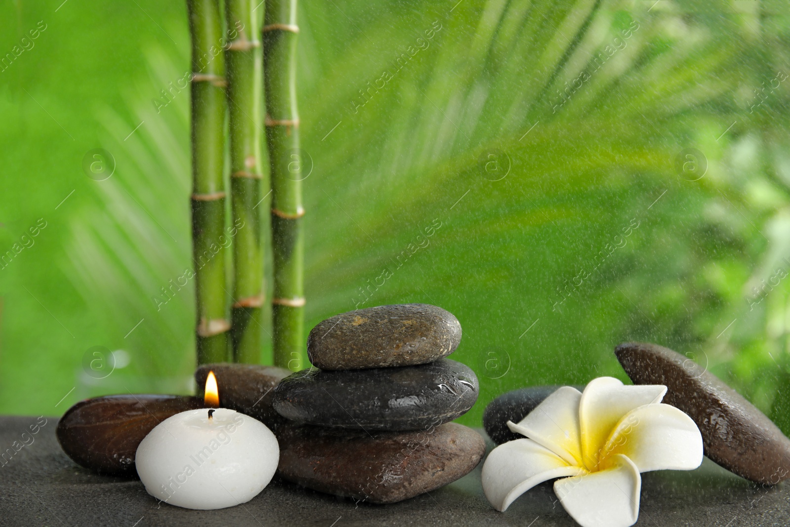 Photo of Composition with stones on table against blurred background. Zen concept