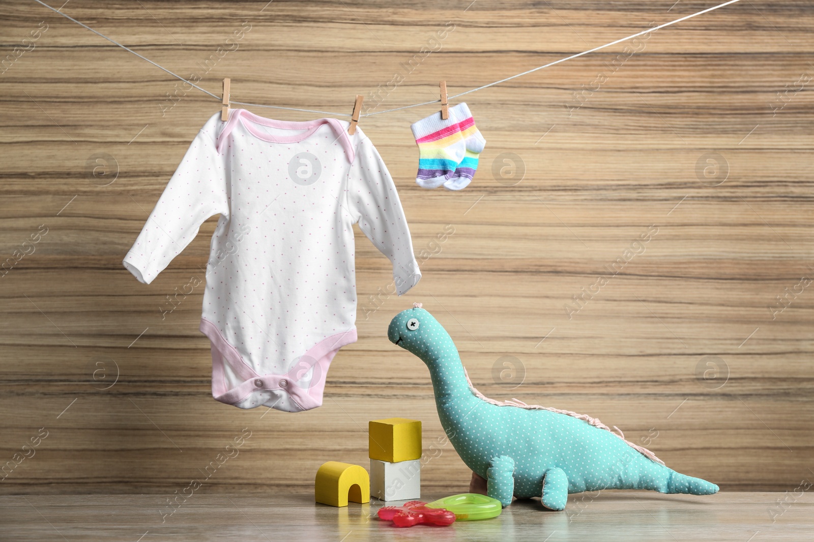 Photo of Composition with baby accessories on wooden background