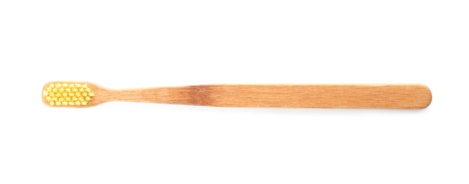 Toothbrush made of bamboo on white background, top view