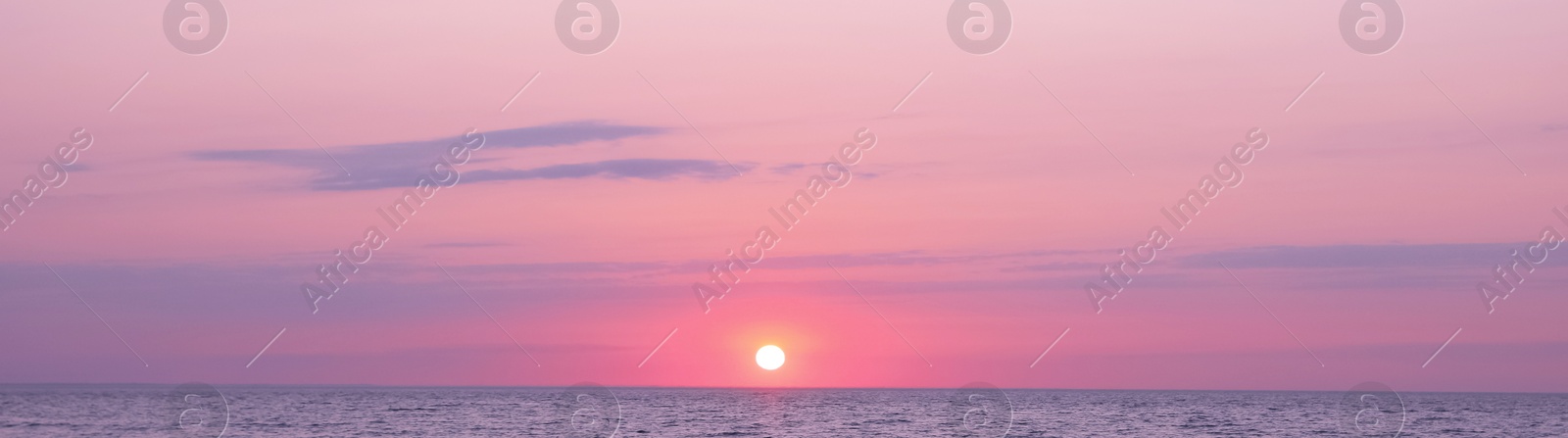 Image of Beautiful panorama of sky over sea at sunset. Banner design