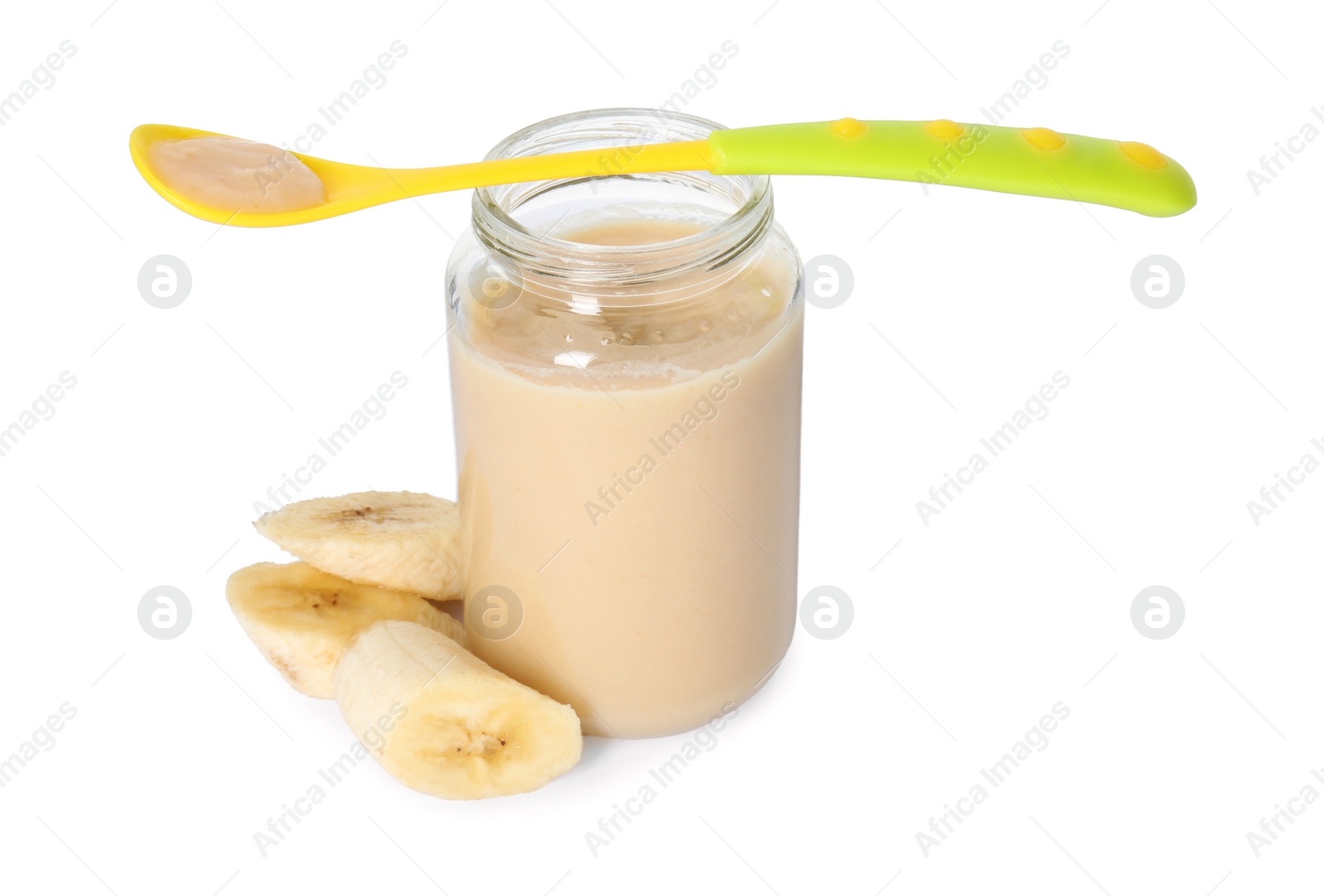 Photo of Tasty baby food in jar, spoon and fresh banana isolated on white