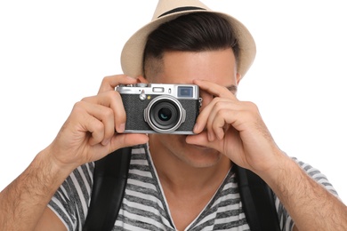 Man with straw hat taking picture on white background, closeup. Summer travel