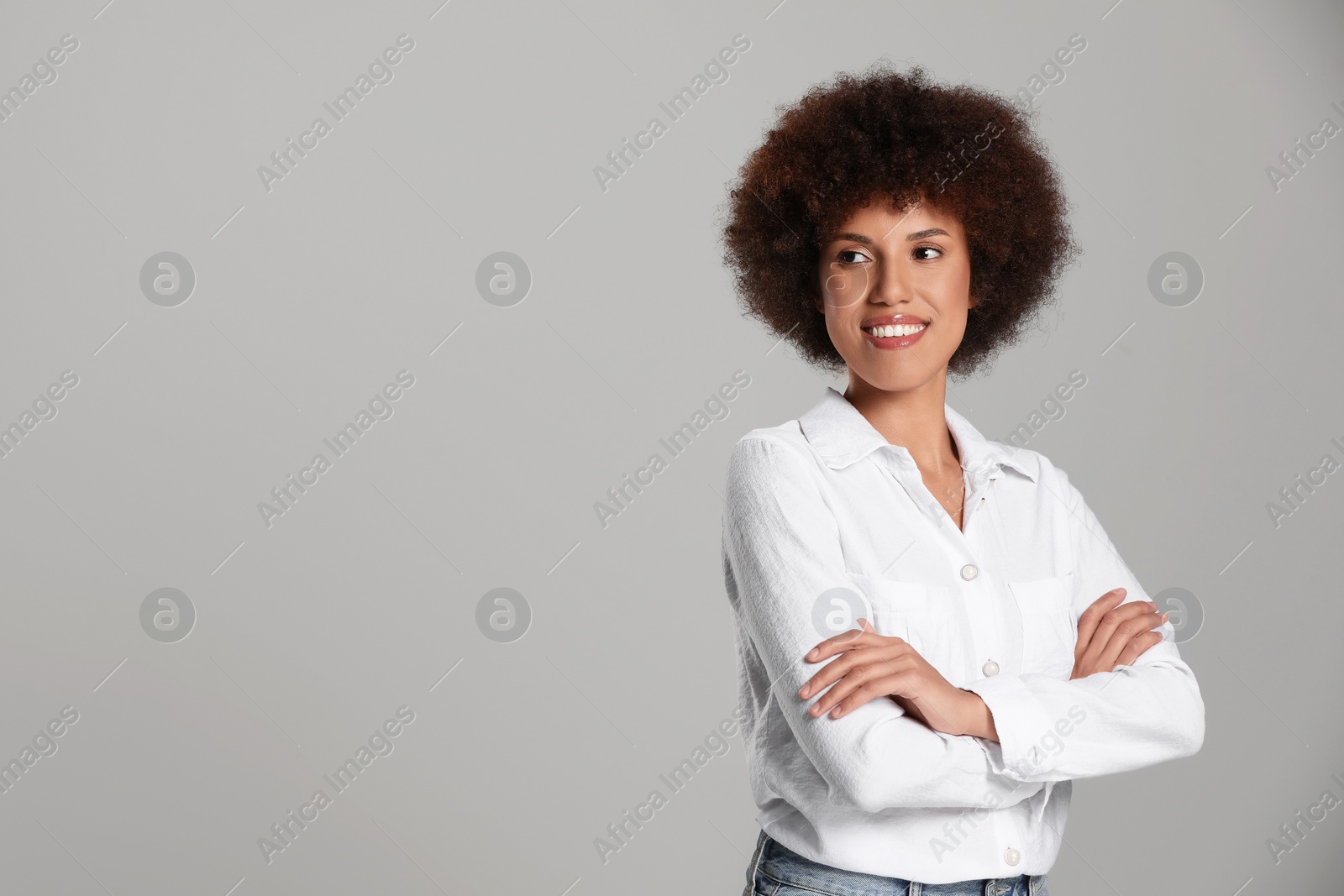 Photo of Portrait of beautiful young woman on grey background. Space for text