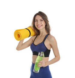 Beautiful woman with yoga mat and bottle of water on white background