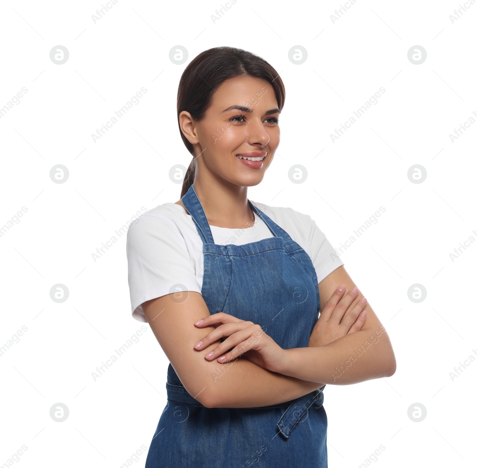 Photo of Young woman in blue apron on white background