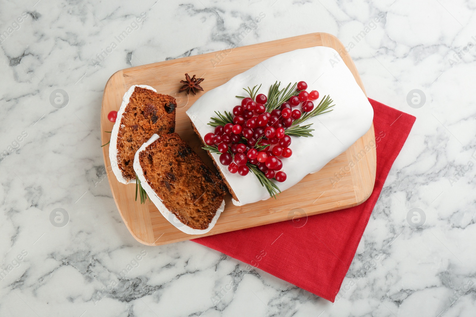 Photo of Traditional Christmas cake on white marble table, flat lay. Classic recipe