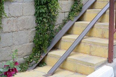 View of stone stairs with ramp outdoors