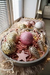 Photo of Beautiful Christmas tree baubles on window sill indoors