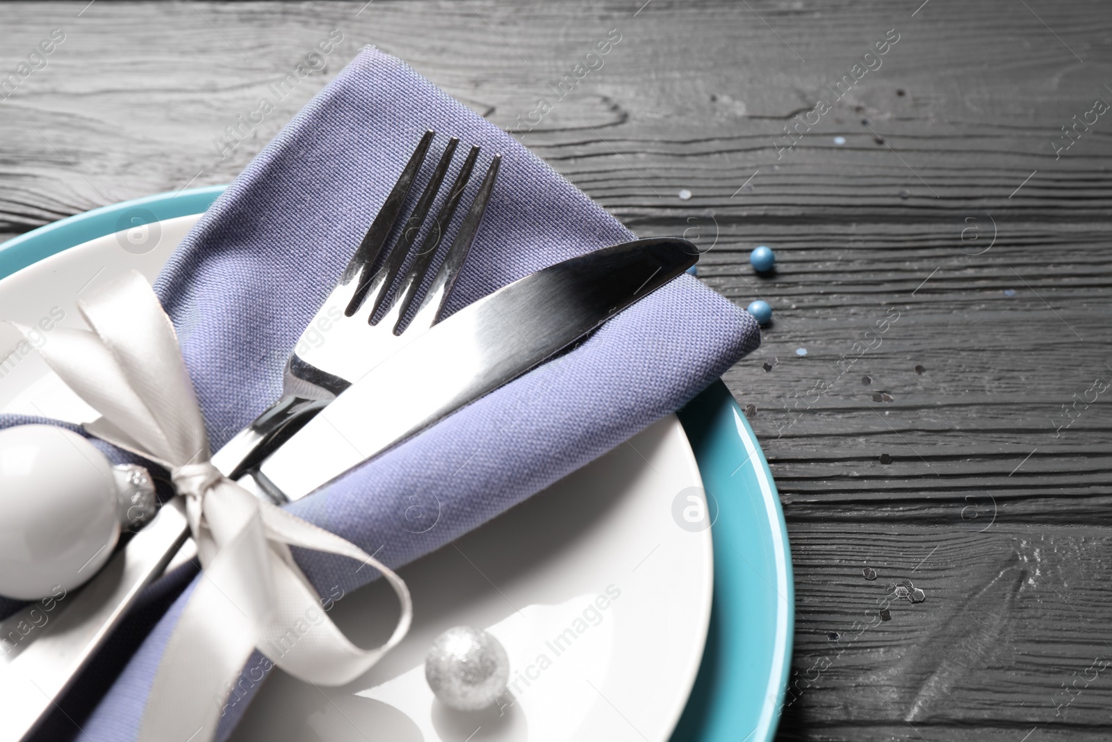 Photo of Beautiful Christmas table setting on grey wooden background, closeup