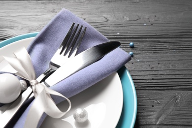 Beautiful Christmas table setting on grey wooden background, closeup