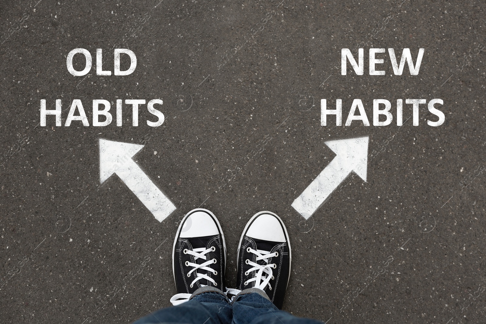 Image of Person standing near arrows with two opposite directions to Old and New Habits on asphalt, top view