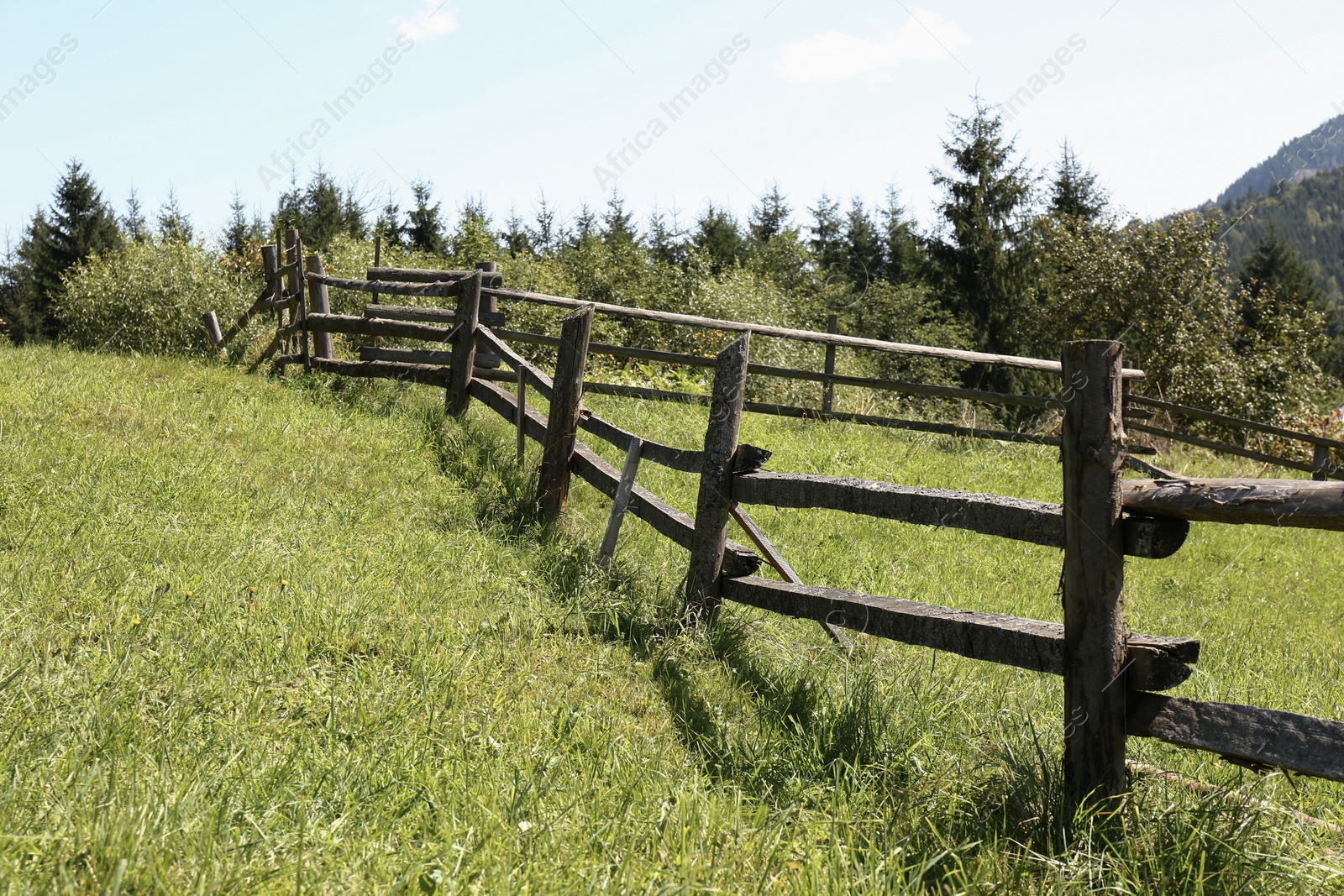 Photo of Beautiful view of mountain countryside with wooden fence