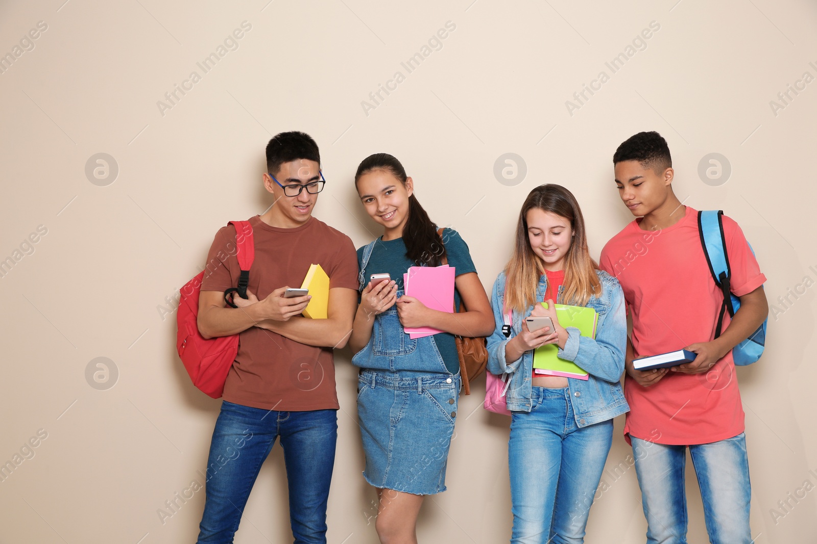 Photo of Group of teenagers on color background. Youth lifestyle and friendship