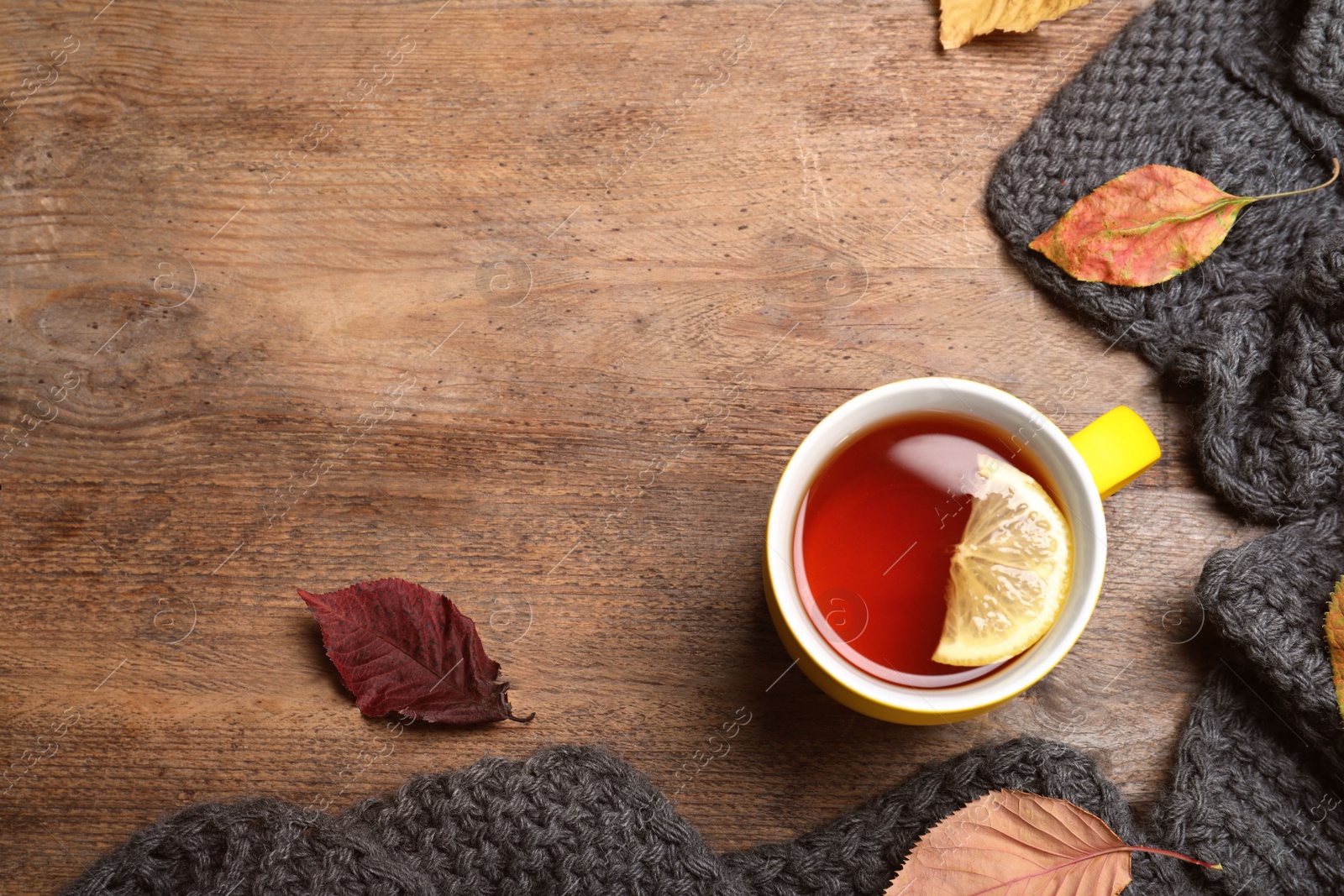 Photo of Flat lay composition with hot drink on wooden background, space for text. Cozy autumn