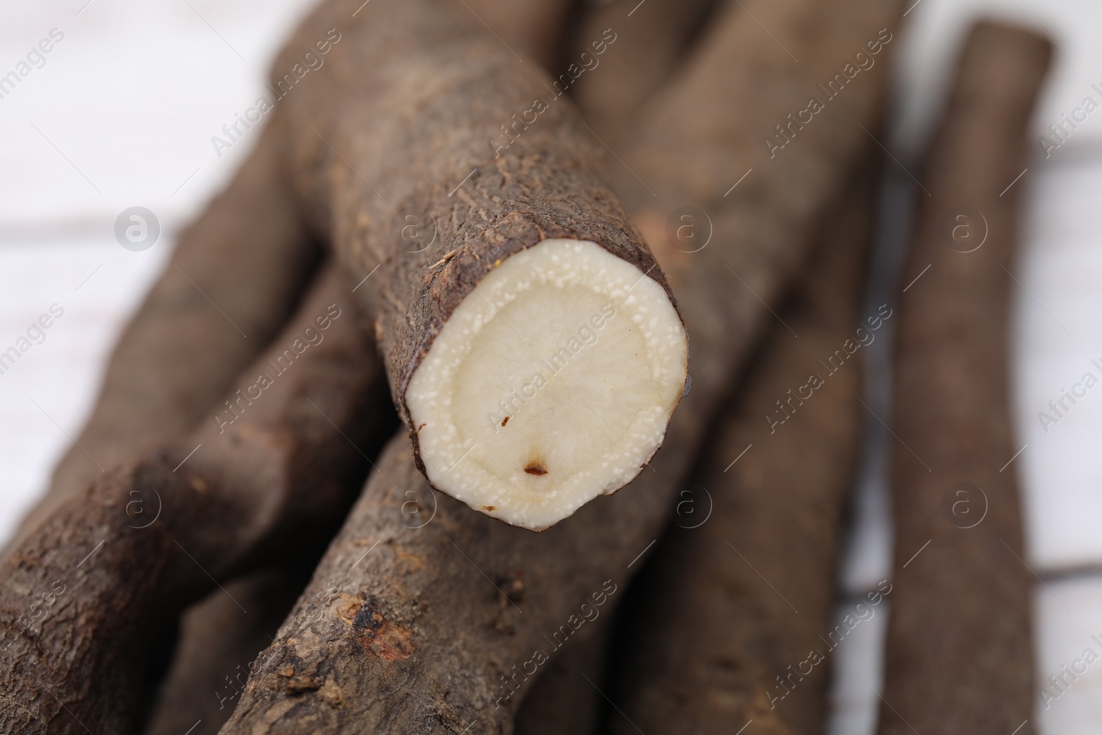 Photo of Raw salsify roots on table, closeup view