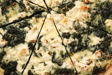 Delicious homemade spinach quiche on as background, closeup