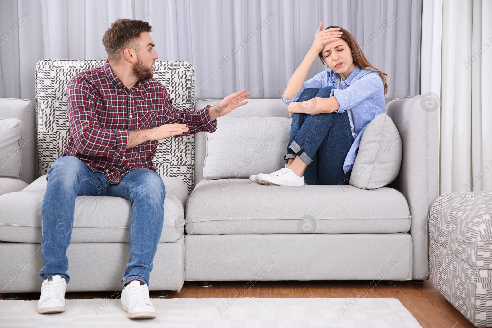 Photo of Couple having quarrel at home. Relationship problems