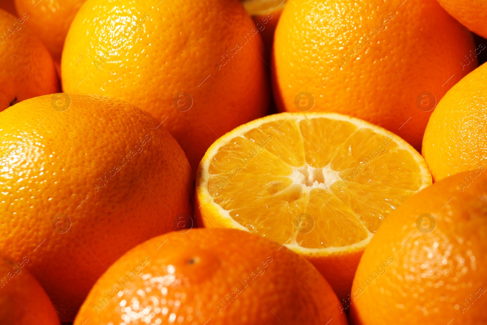 Photo of Tasty ripe fresh oranges as background, closeup