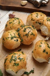 Photo of Traditional Ukrainian bread (Pampushky) with garlic on parchment