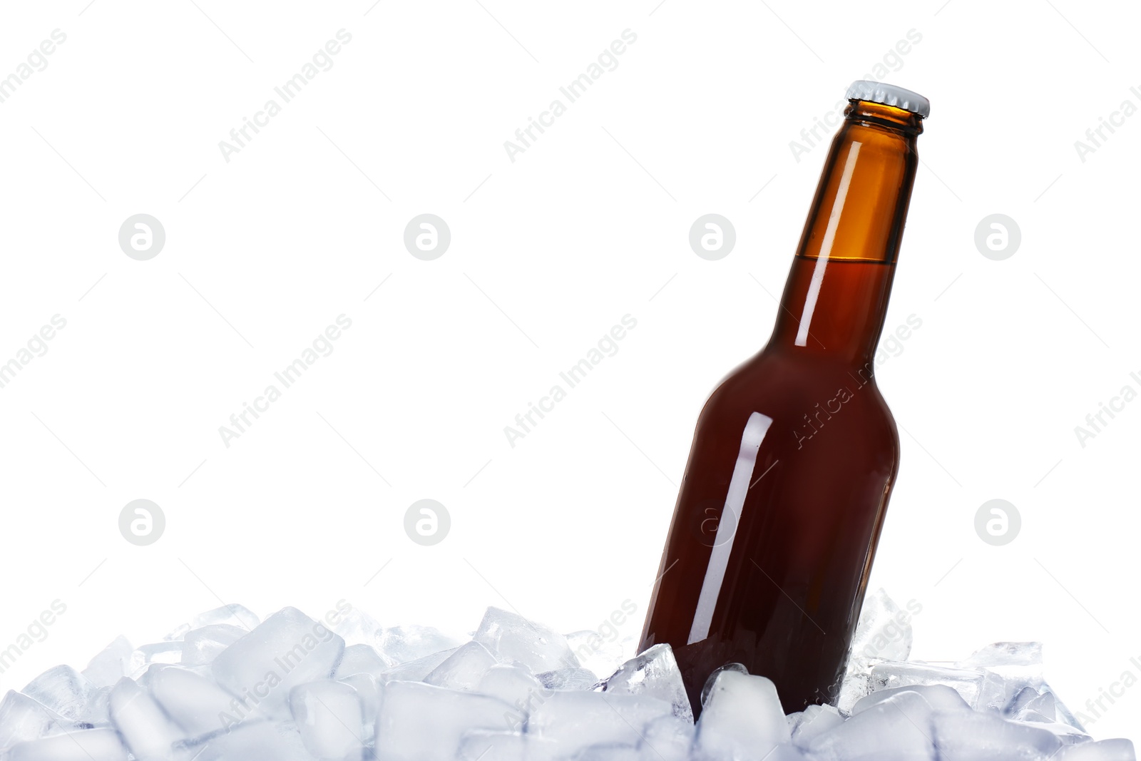 Photo of Bottle of beer on ice cubes against white background