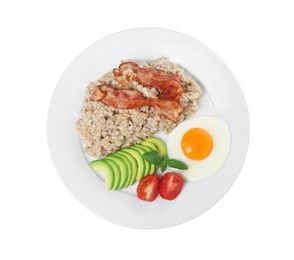 Photo of Delicious boiled oatmeal with fried egg, bacon, avocado and tomato isolated on white, top view