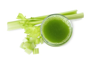 Glass of celery juice and fresh vegetable on white background, top view