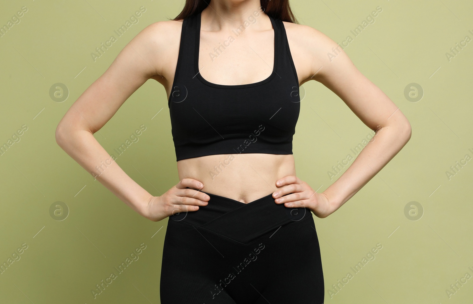 Photo of Woman with slim body on green background, closeup