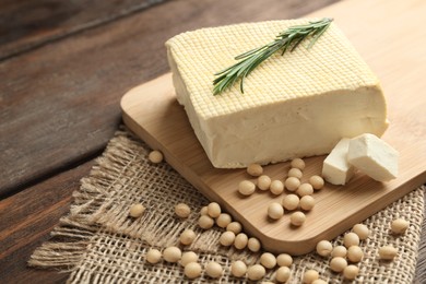 Delicious tofu with rosemary and soy on wooden table