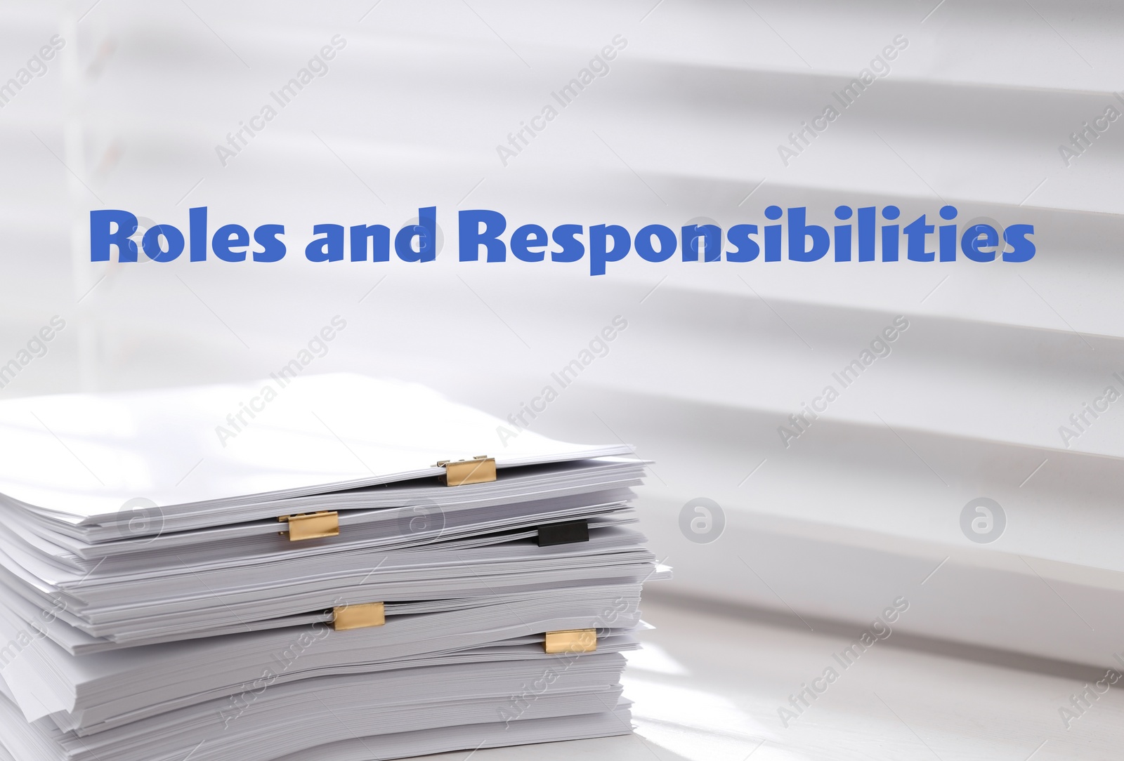 Image of Roles and Responsibilities concept. Stack of paper on window sill indoors