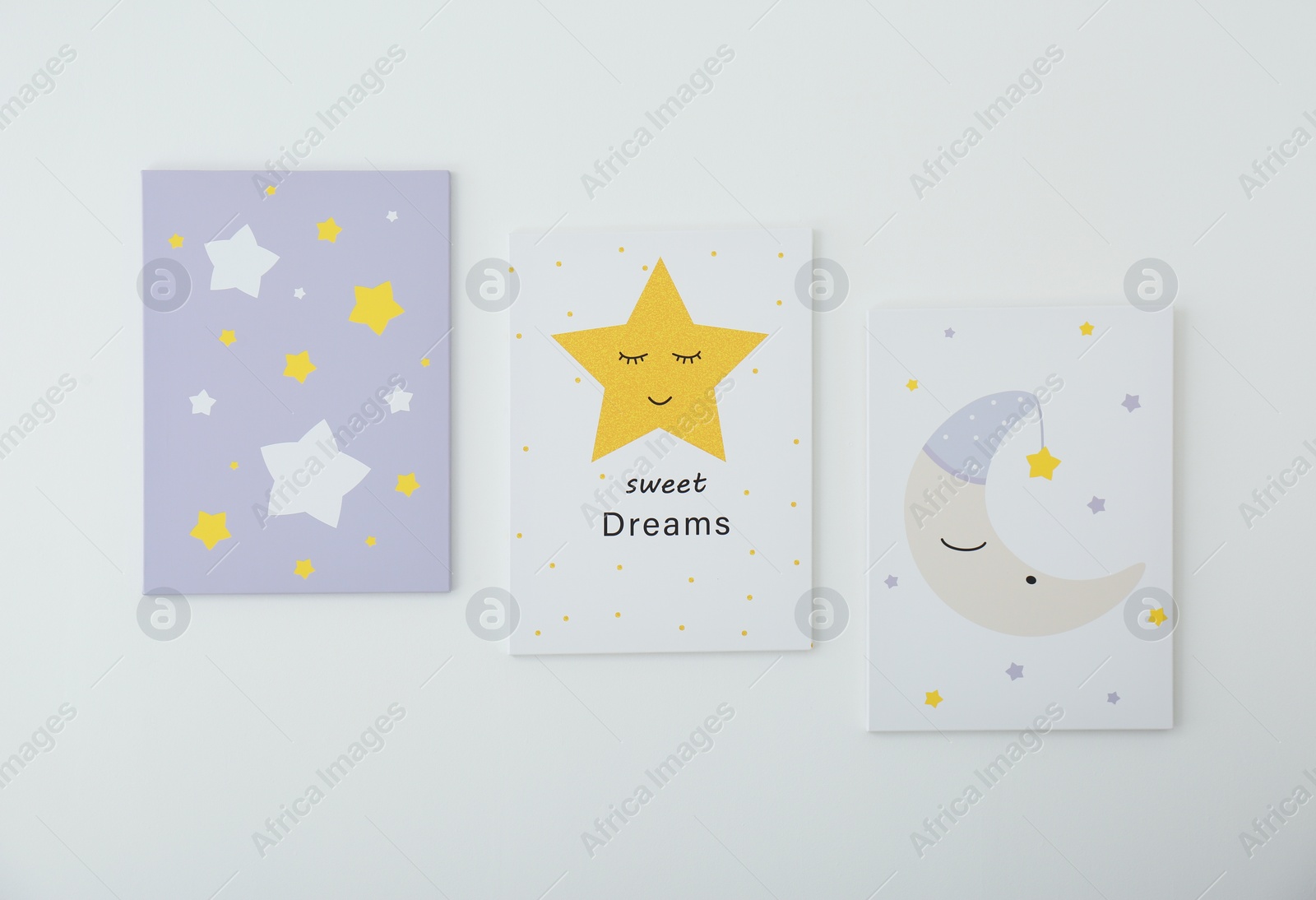 Photo of Different cute pictures on white wall. Children's room interior elements